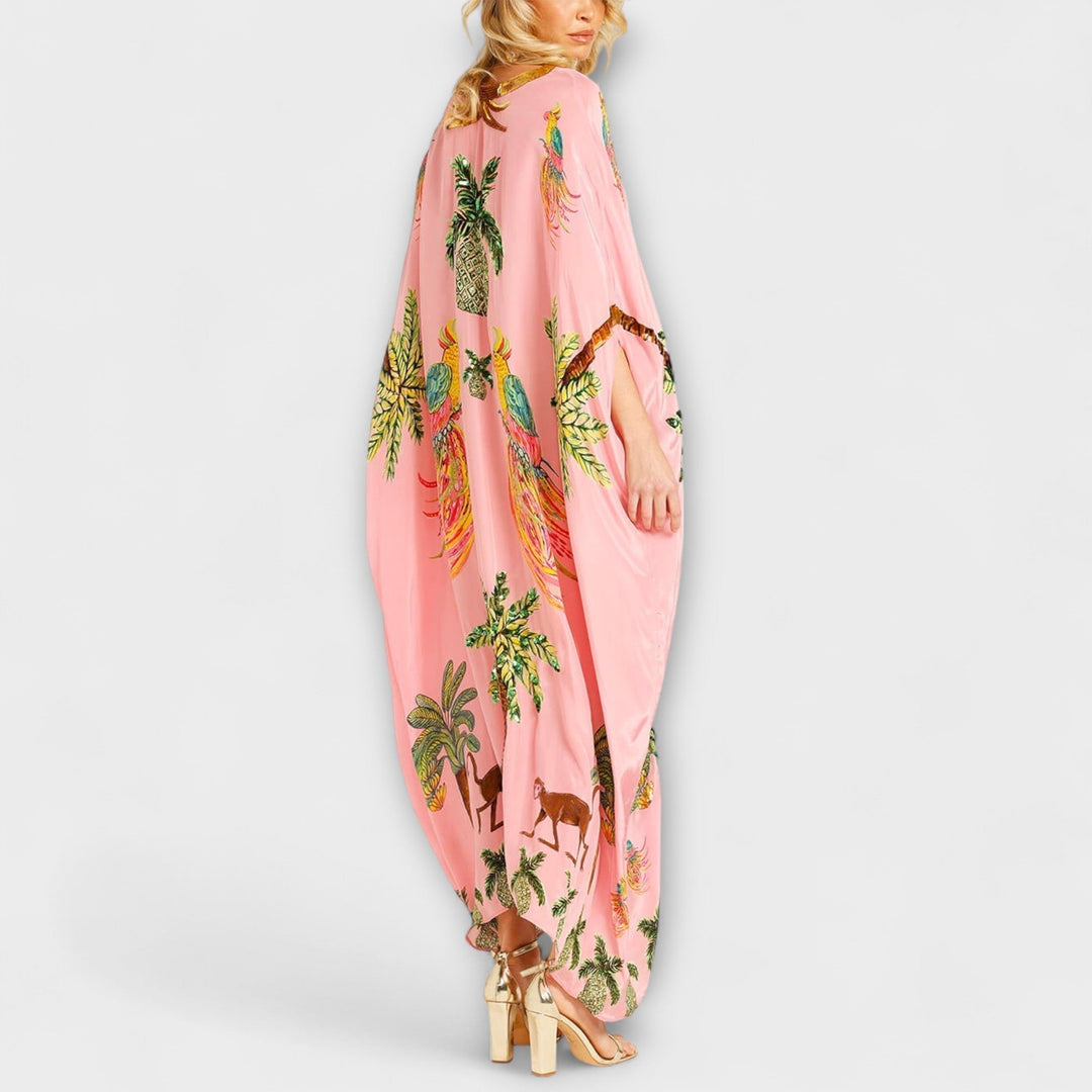 Robe longue femme, asymétrique, imprimé cocotier. Une tenue tendance et légère pour les chaudes journées d'été.