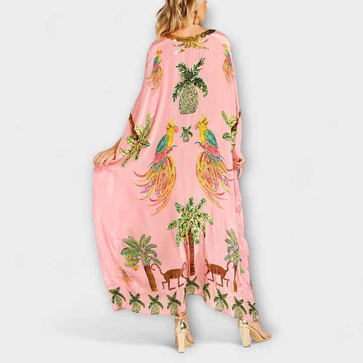 Robe d'été longue femme, asymétrique, imprimé cocotier. Idéale pour un look décontracté ou chic en vacances.