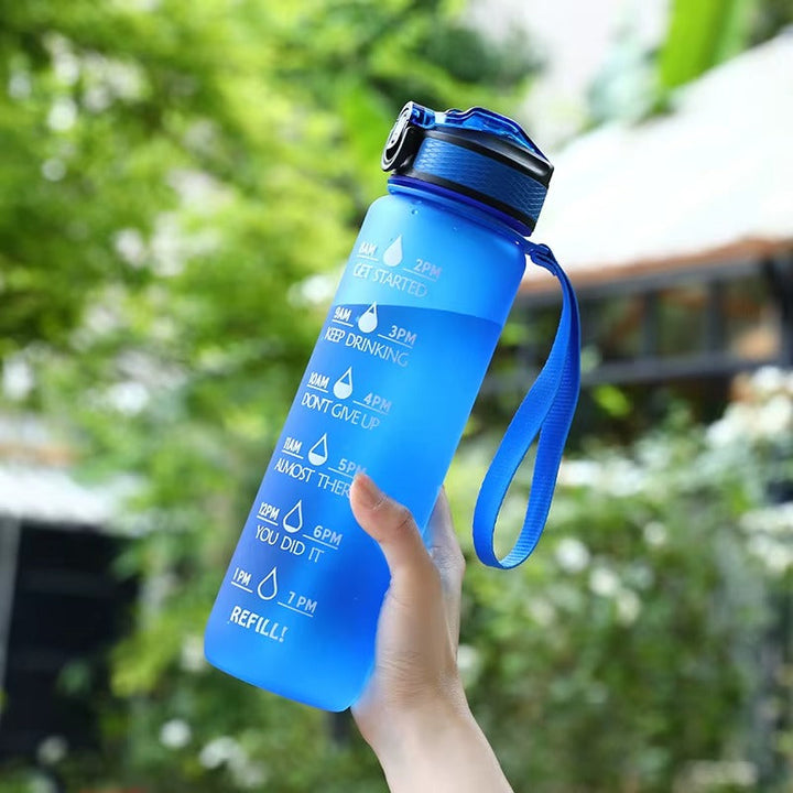 Bouteille d'eau motivante 900ml pour sport, fitness. Gourde étanche sans BPA, idéale hydratation gym.