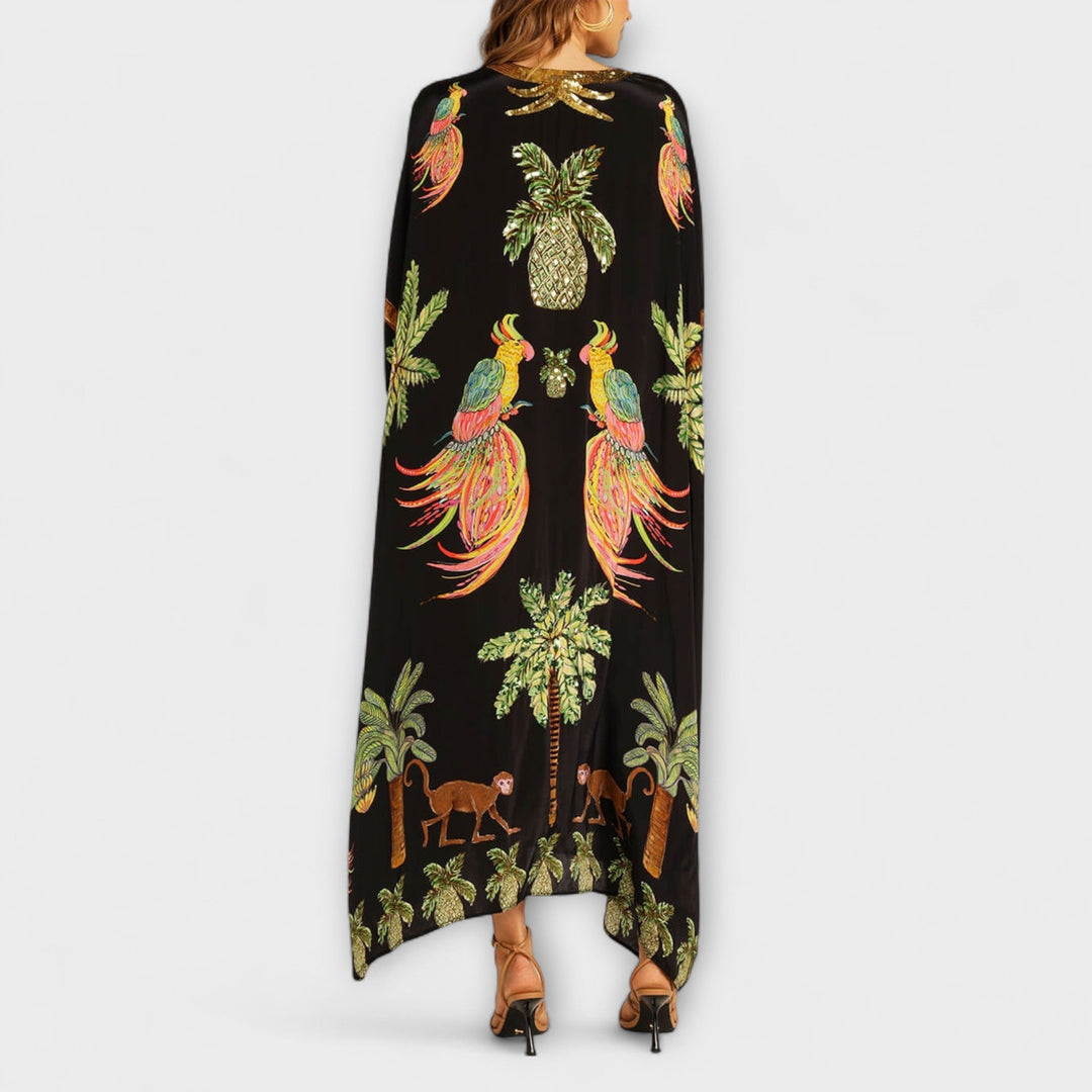 Robe longue femme, imprimé cocotier, asymétrique. Un indispensable pour les vacances d'été et la plage.