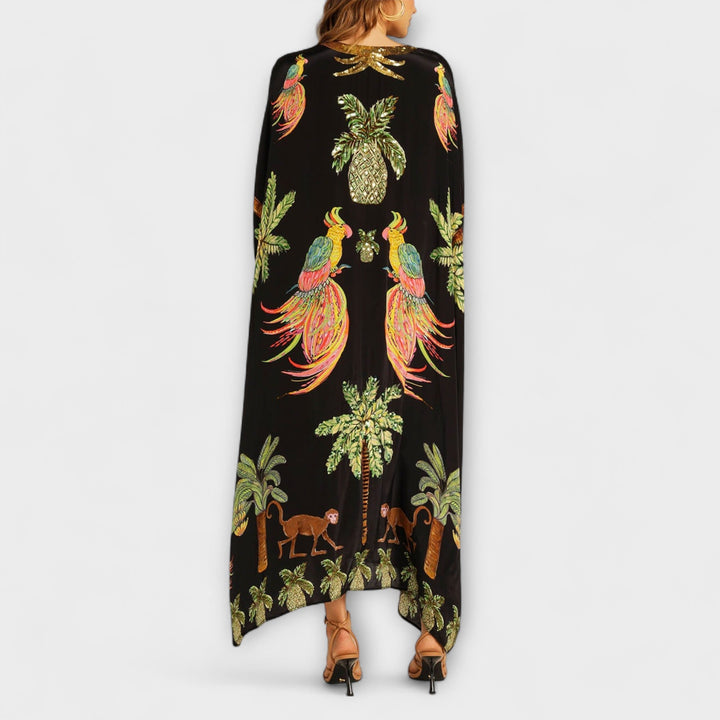 Robe longue femme, imprimé cocotier, asymétrique. Un indispensable pour les vacances d'été et la plage.