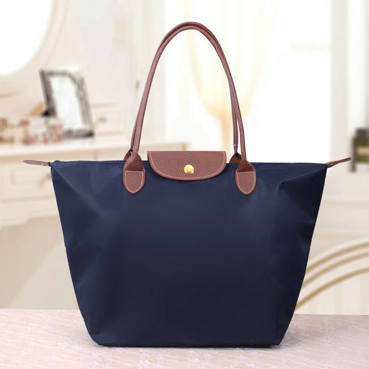 Sac femme mode chic, polyvalent pour le quotidien, avec de nombreux compartiments pour tout organiser.