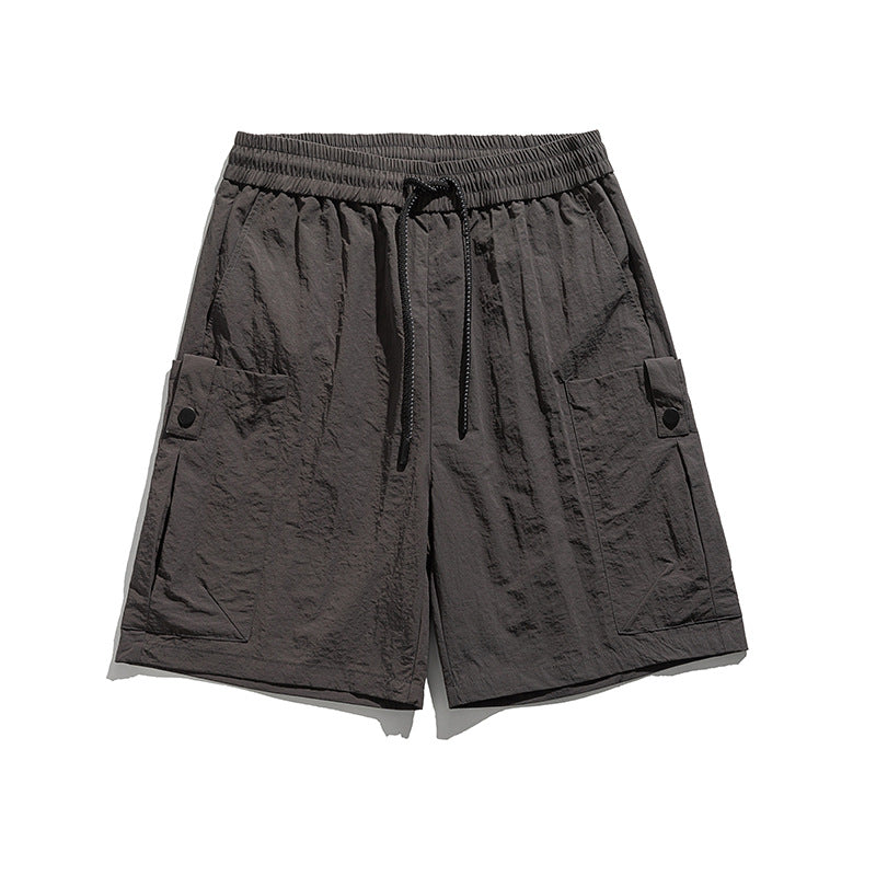 Short de sport Dryfit décontracté pour hommes, coupe athlétique. Idéal entraînement ou activités estivales.