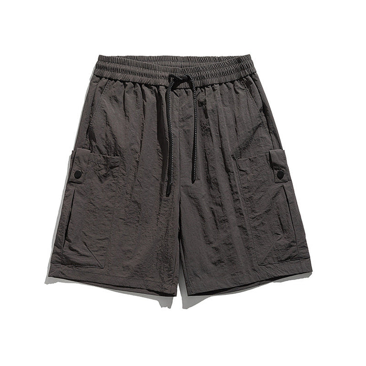 Short de sport Dryfit décontracté pour hommes, coupe athlétique. Idéal entraînement ou activités estivales.