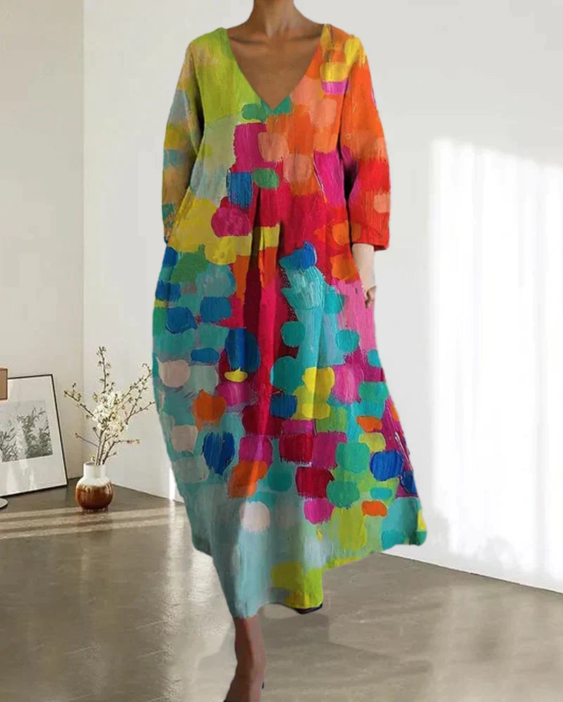 Magnifique robe femme imprimée à motifs vifs, décolleté en V. Style élégant et vibrant pour l'été casual.