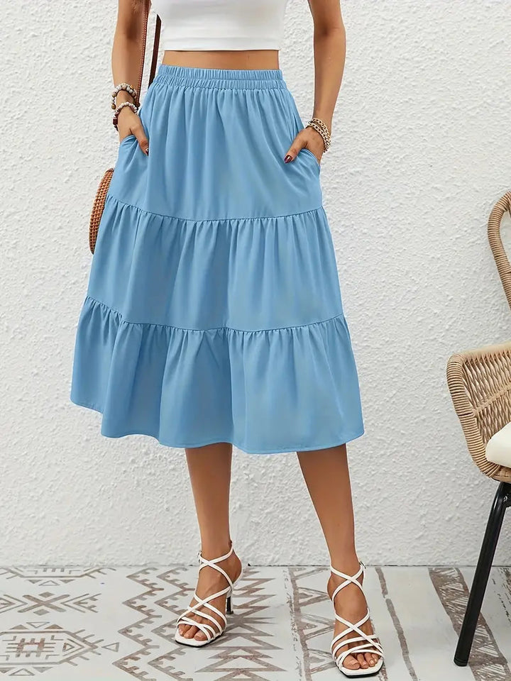 Vêtement femme: jupe florale évasée avec poches, un bas léger et stylé pour le printemps et l'été.