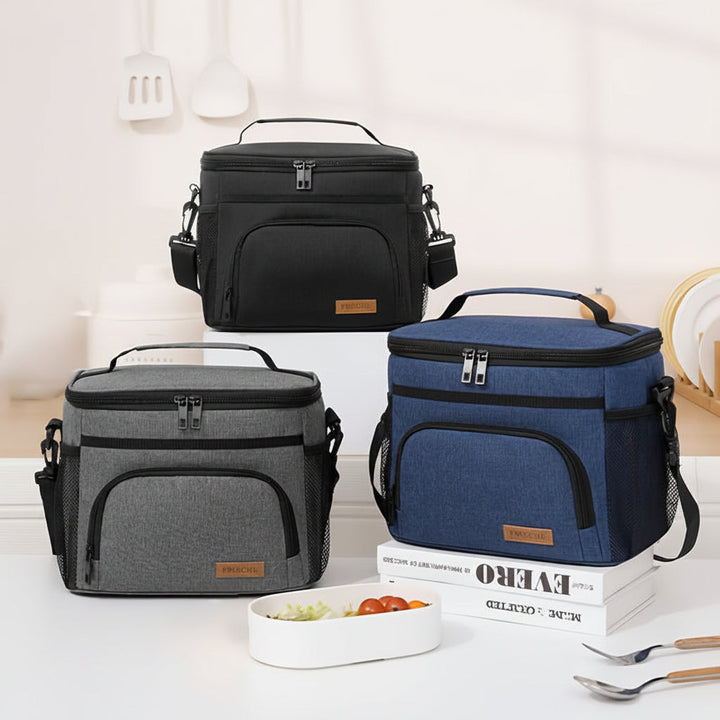 Sac à lunch isotherme noir élégant avec bandoulière. Garde les repas frais et transportables pour le travail, l'école ou les sorties.