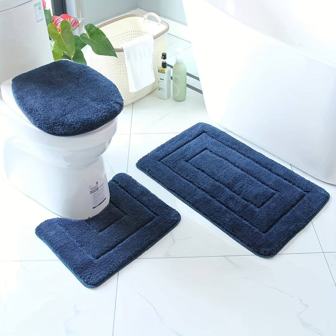 Décorez votre salle de bain avec cet ensemble de tapis moelleux et absorbants, facile d'entretien.