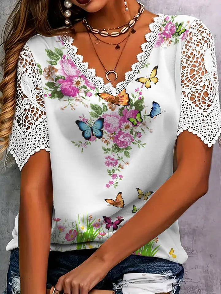 Haut floral femme élégant, décolleté V, manches courtes en dentelle. Idéal mode printemps été romantique.