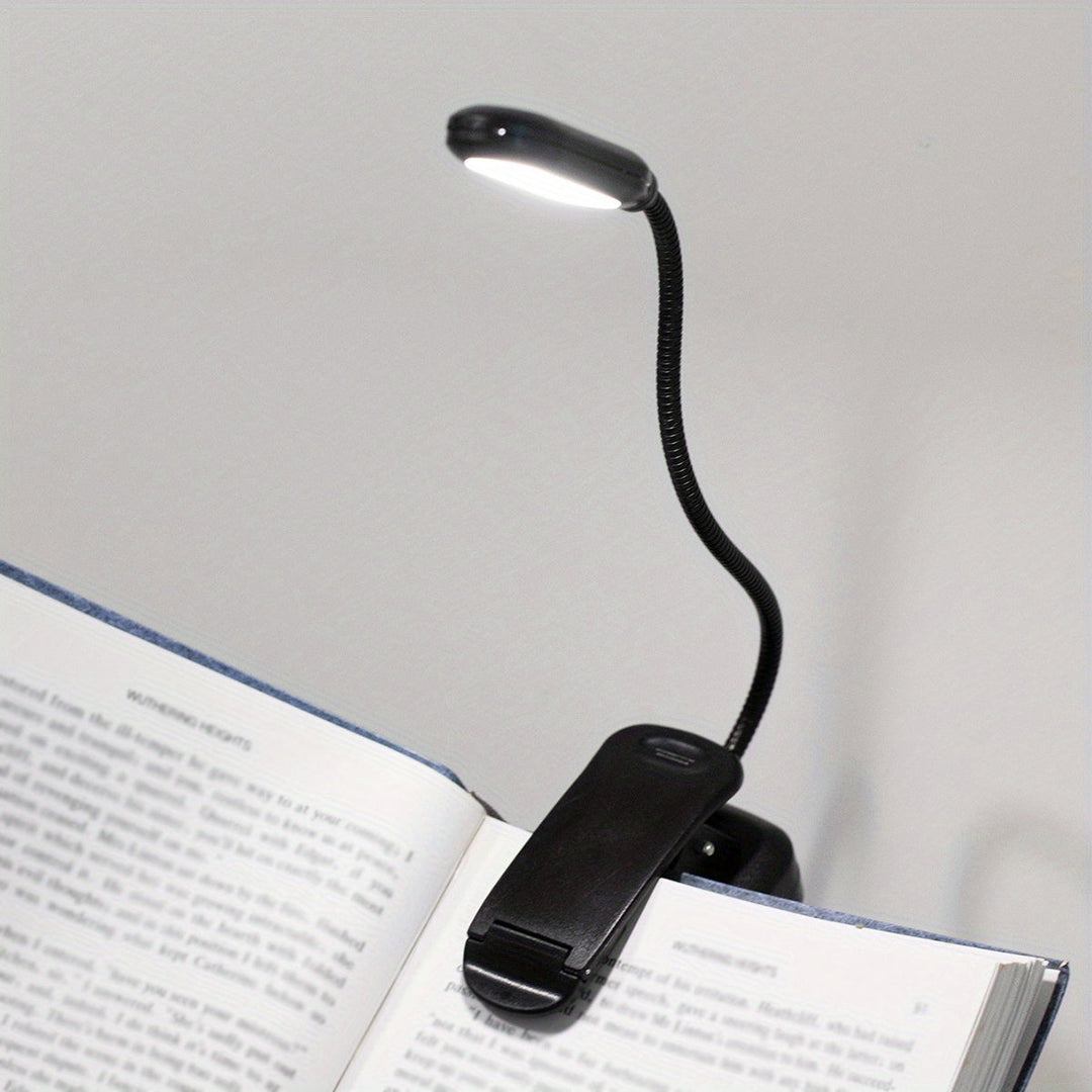 Lampe LED de lecture à batterie, avec pince et col flexible, conçue pour la lecture dans le lit ou sur un livre.