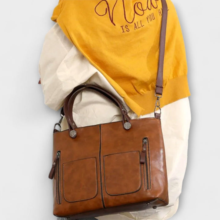 Sac fourre-tout élégant en cuir femme. Design moderne et chic, parfait pour transporter vos essentiels avec style.