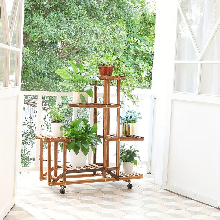 Étagère à plantes en bois carbonisé résistant, idéale pour le jardinage vertical en extérieur.