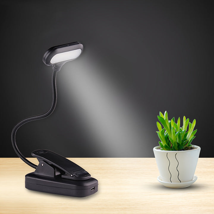 Lampe d'appoint compacte à pince, idéale pour lecture nocturne ou comme lumière de voyage. Col flexible.