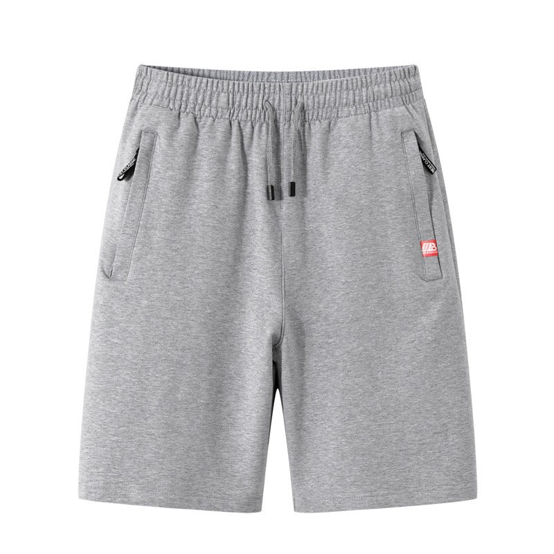 Short homme confortable kaki pour l'été. Design polyvalent avec poches zippées, parfait pour activités sportives ou loisirs.