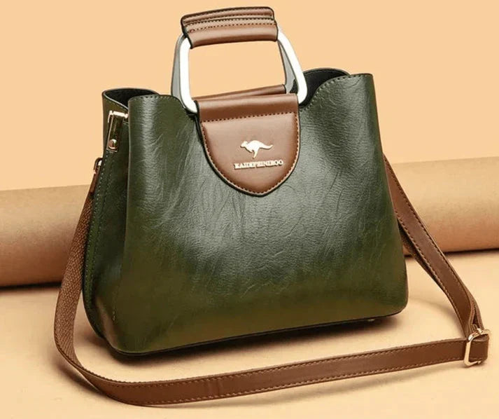 Sac à main femme en cuir avec multiples compartiments, idéal pour l'organisation quotidienne.