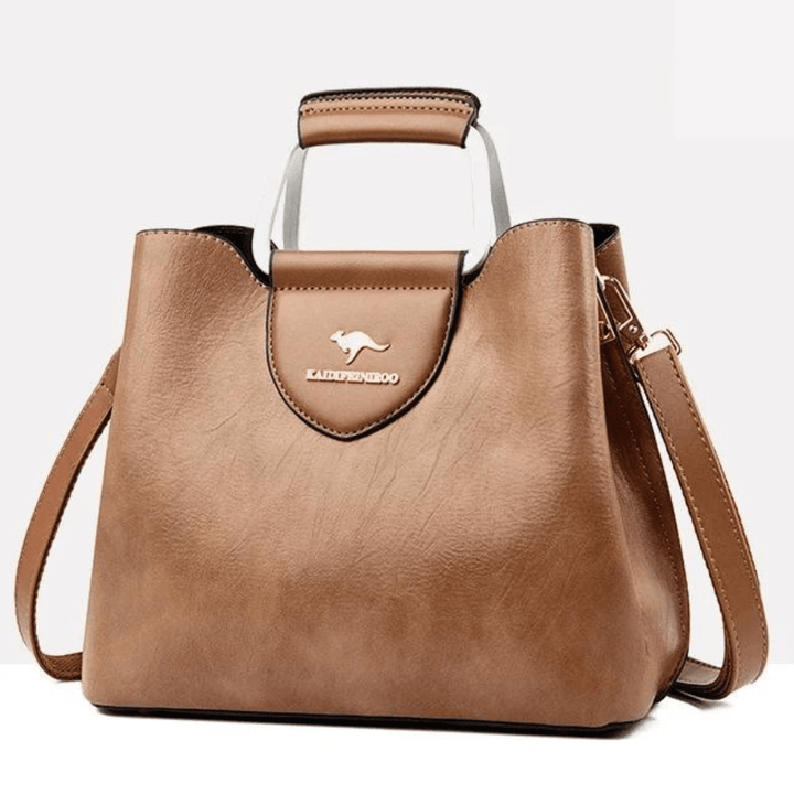 Sac à main femme en cuir lisse, un classique chic et raffiné, parfait pour rehausser votre style.
