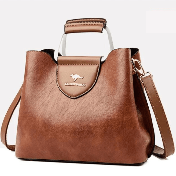 Sac à main en cuir au design moderne pour femme, alliant chic, élégance et fonctionnalité.