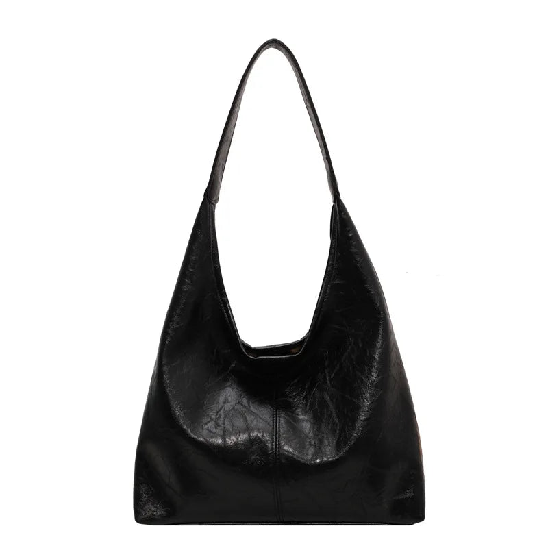 Sac à main femme en cuir, grand et pratique. Bandoulière ajustable, idéal pour organiser vos essentiels quotidiens.