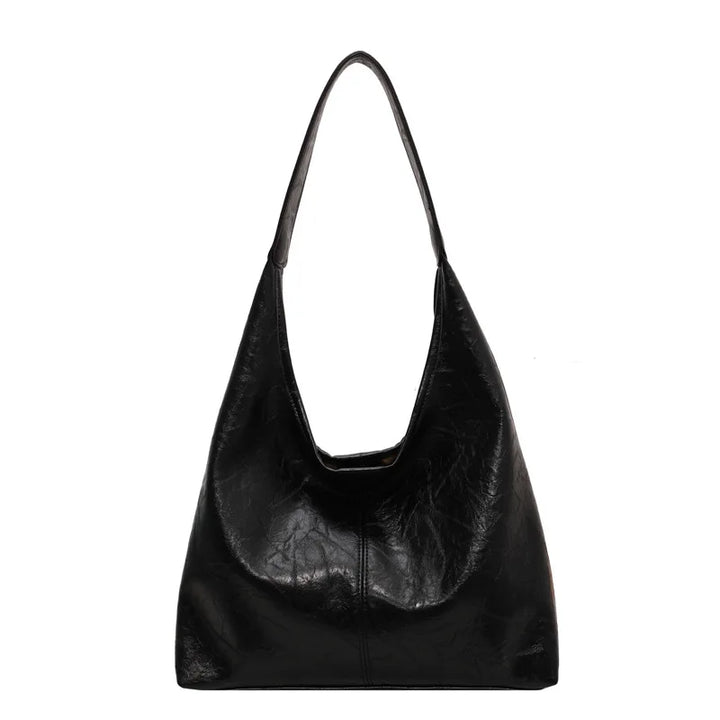 Sac à main femme en cuir, grand et pratique. Bandoulière ajustable, idéal pour organiser vos essentiels quotidiens.