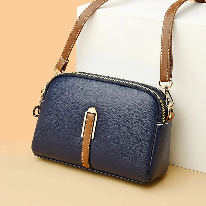 Sac à main en cuir véritable, design raffiné pour un look chic et féminin.