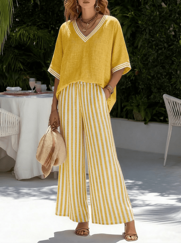 Ensemble femme chic à rayures: pantalon large fluide et haut col V. Parfait pour un style décontracté estival.