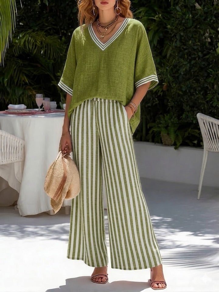 Silhouette élégante avec cet ensemble femme: pantalon large fluide et haut col V. Confort pour l'été.