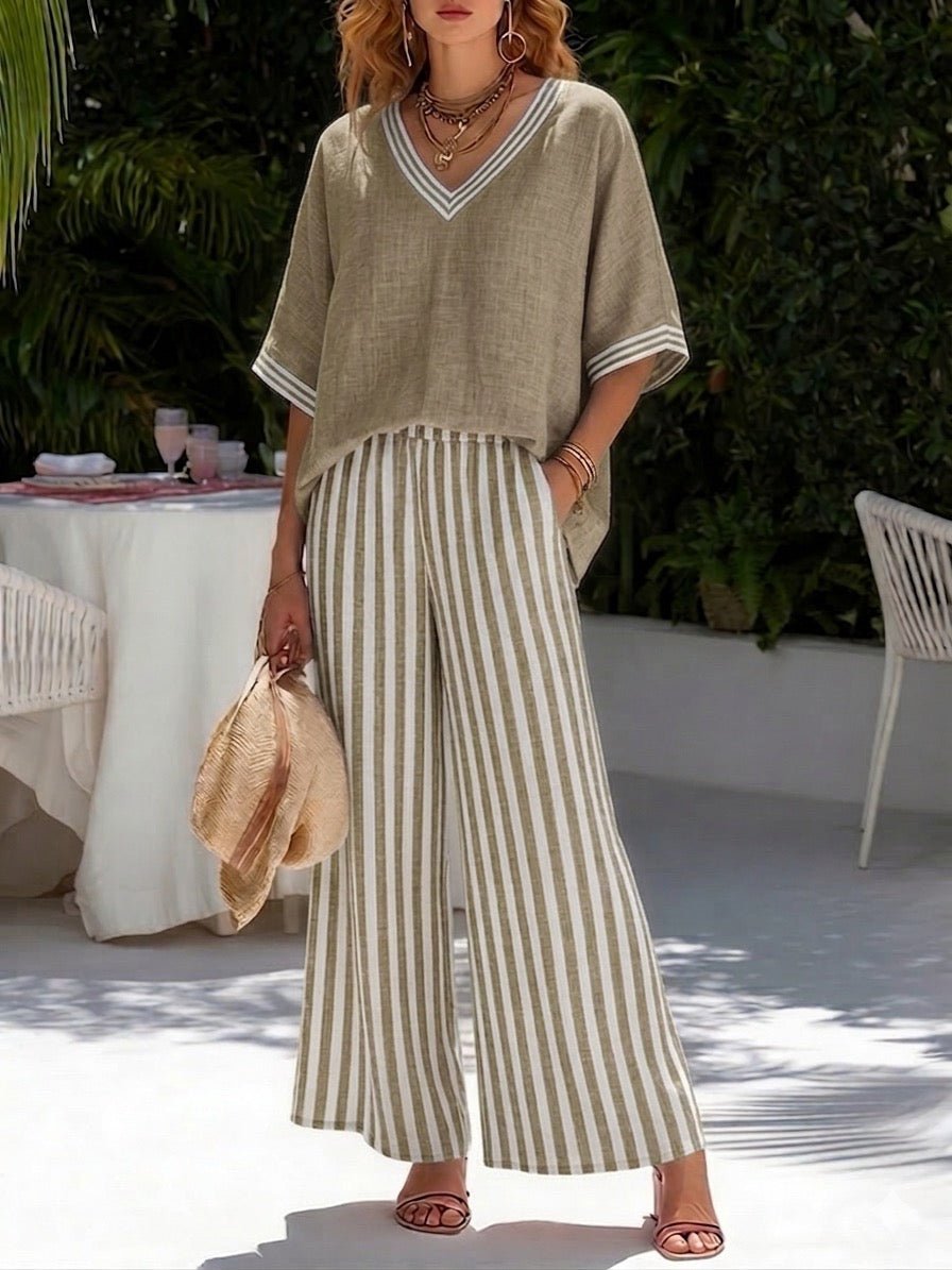 Ensemble femme élégant et confortable : pantalon large rayé et haut col V. Idéal pour une tenue décontractée.