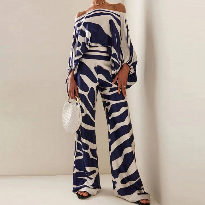 Ensemble femme deux pièces chic décontracté, épaules dénudées, pantalon large, manches bouffantes.