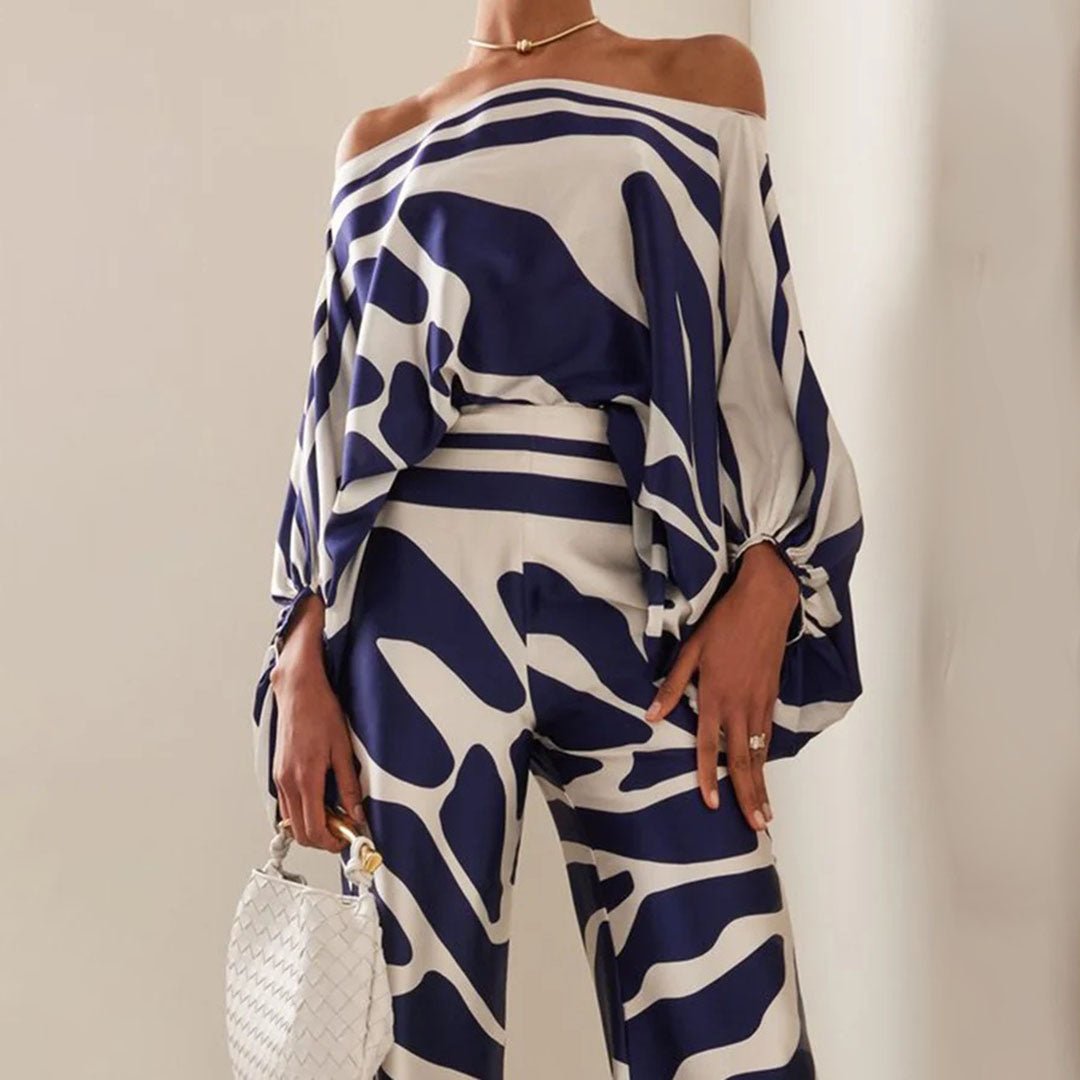 Pantalon large fluide pour femme, idéal avec un haut asymétrique, pour un ensemble deux-pièces chic et estival.