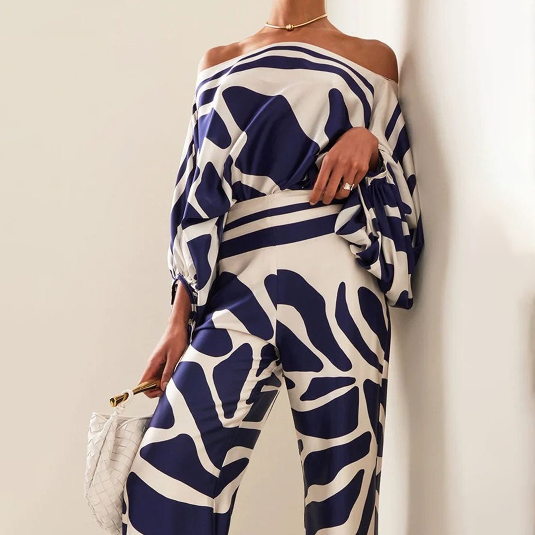 Tenue estivale femme élégante: ensemble deux-pièces avec haut asymétrique et pantalon fluide. Mode chic et décontractée.