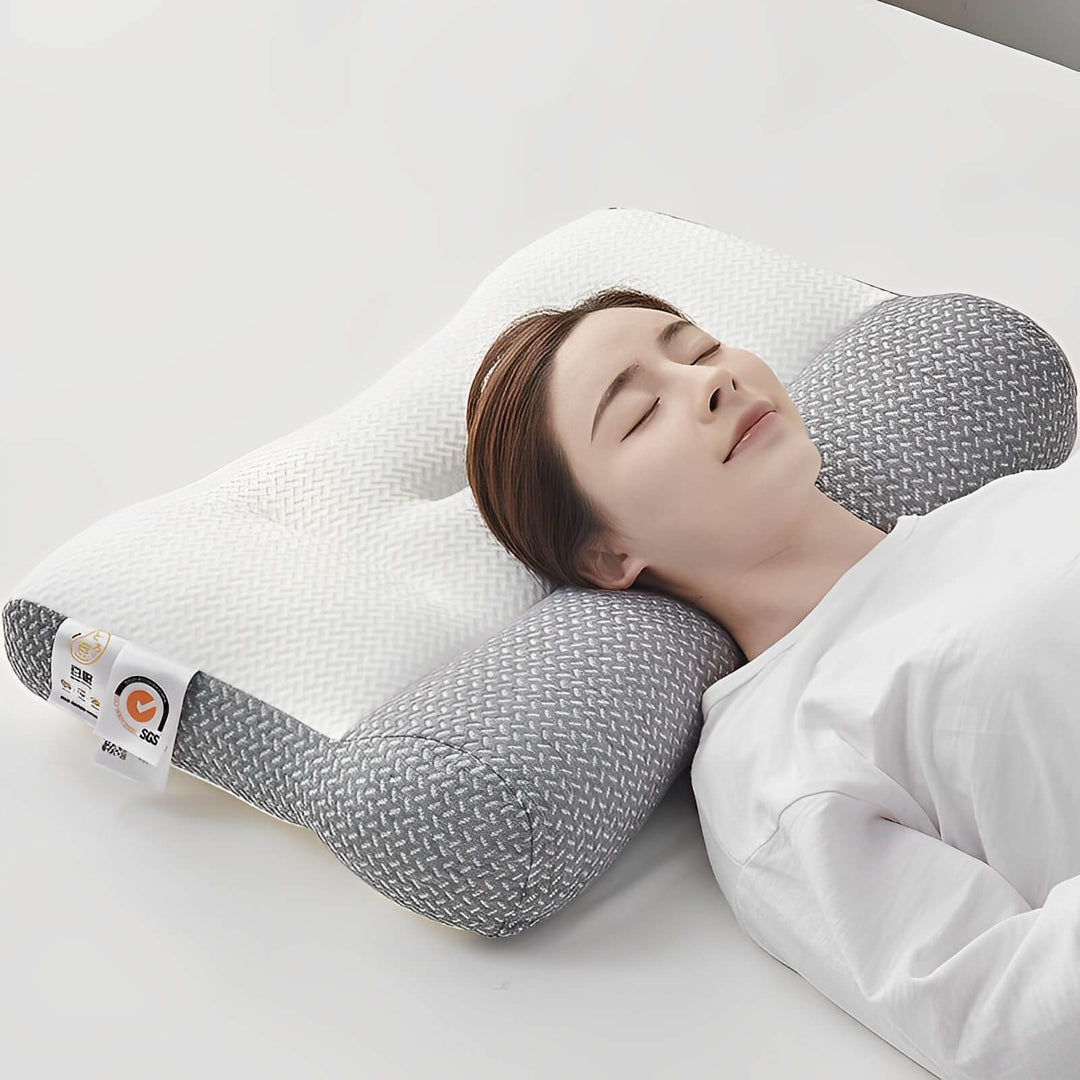 Coussin de literie ergonomique gris en mousse à mémoire de forme pour un soutien parfait de la nuque et des cervicales.