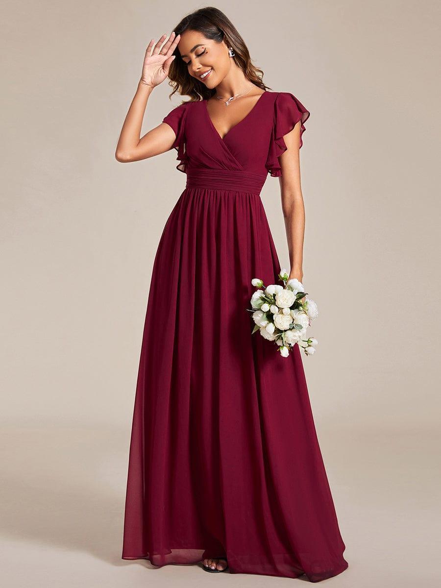 Robe de soirée femme, col en V, manches courtes, dos ouvert. Parfaite pour fête estivale ou mariage.