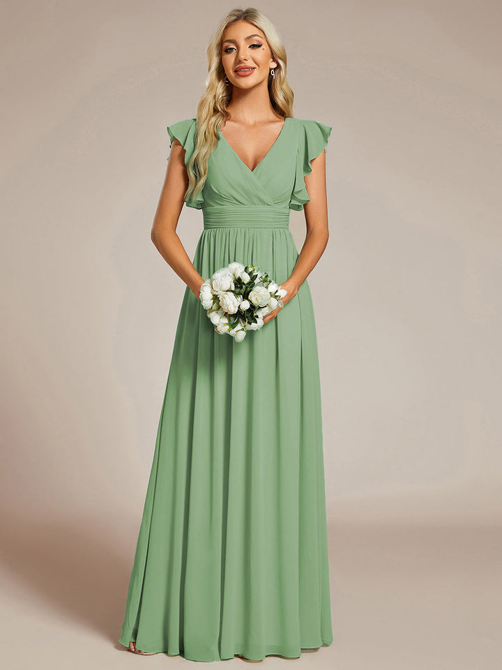Robe de soirée chic, dos ouvert, manches courtes. Maxi et fluide pour une fête élégante et inoubliable.