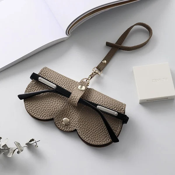 Housse de protection portable en cuir souple pour lunettes de soleil, idéale pour le voyage.