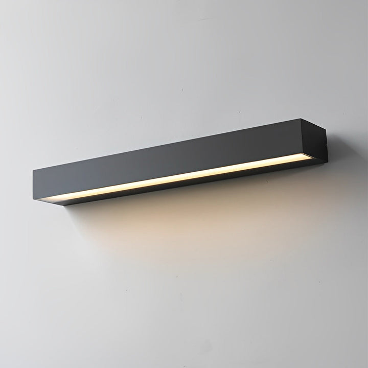 Applique murale LED extérieure compacte et discrète, s'intègre à tout design moderne.