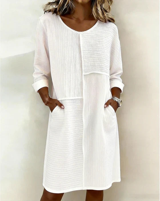 Robe fluide femme en coton lin texturé, coupe élégante et confortable. Idéale pour le printemps-été chic décontracté.