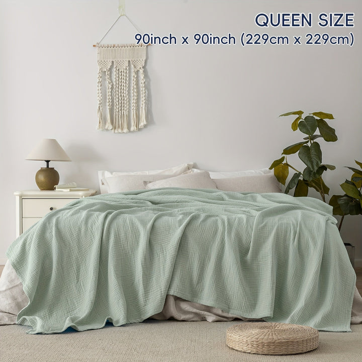 Plaid en coton blanc Cloudsoft, polyvalent pour la décoration ou les siestes estivales.