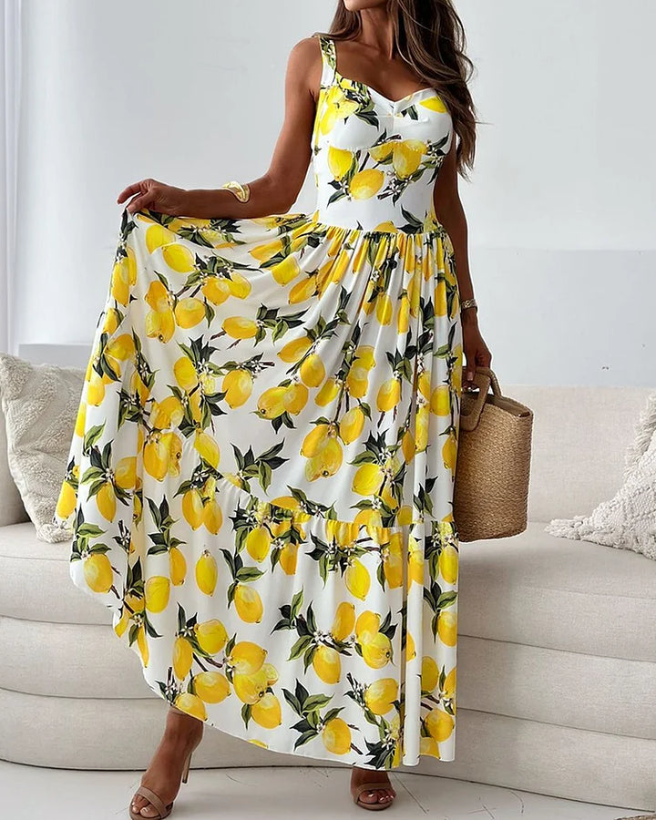 Robe maxi fluide pour femme, jaune avec imprimé floral. Tenue élégante pour invitée de mariage ou soirée spéciale.