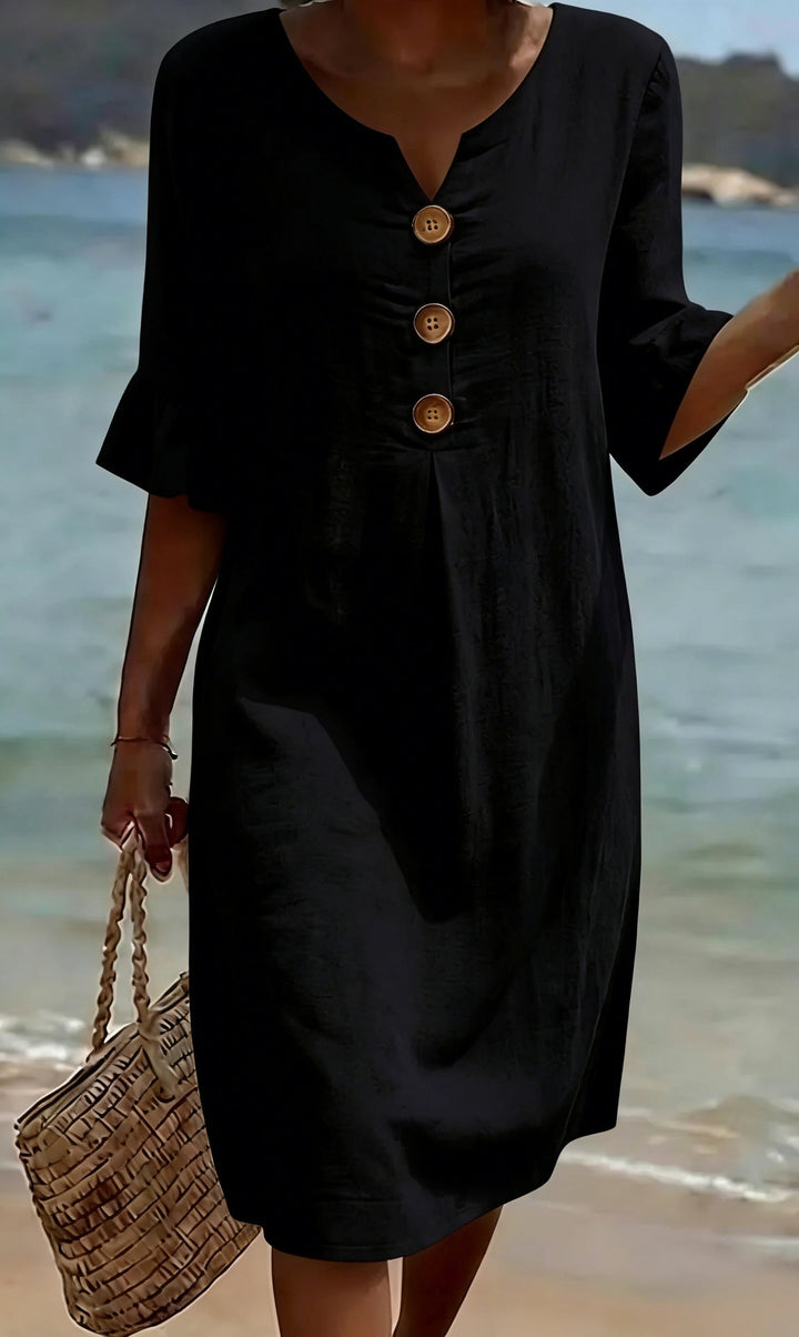 Robe femme décontractée en coton lin, boutonnée sur le devant. Manches volantées. Style fluide et léger.