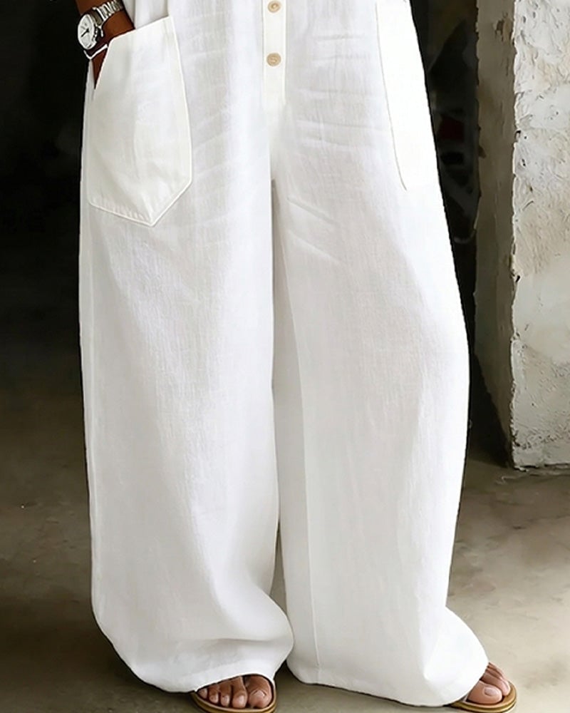 Combinaison femme blanche en coton ample, style chemise. Vêtement élégant et décontracté pour le printemps/été.