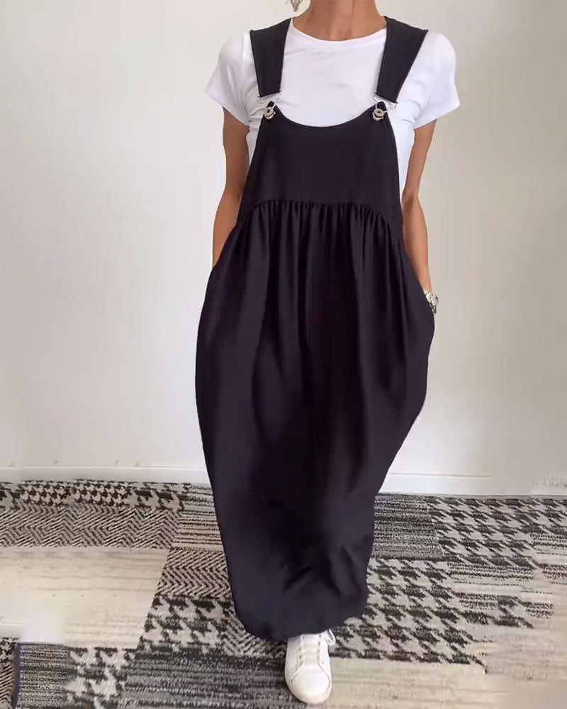 Robe salopette maxi élégante noire pour femme, coupe fluide, style chic et confortable au quotidien.