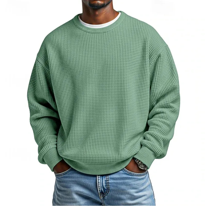 Sweatshirt homme gris chiné en coton doux, offrant chaleur et confort. Parfait pour un style sportswear décontracté.
