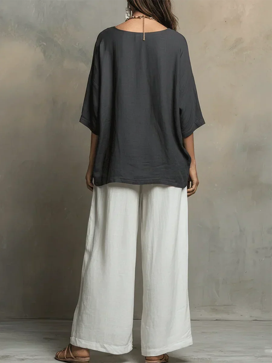 Silhouette fluide et élégante de cet ensemble deux pièces femme. Pantalon ample et haut léger pour l'été chic.