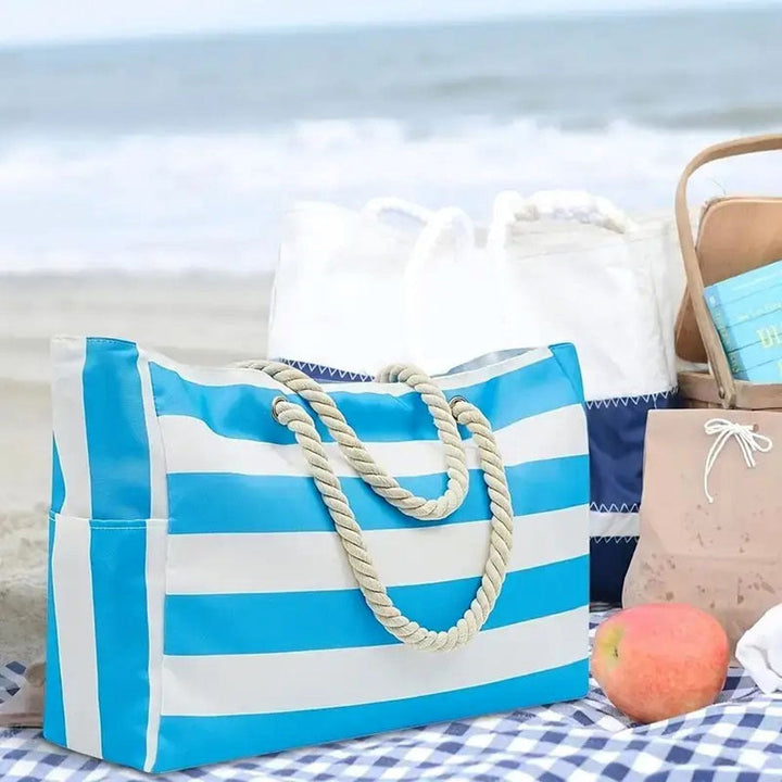 Grand sac de plage femme à rayures, accessoire chic pour vos vacances d'été.
