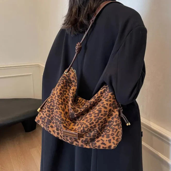 Sac à main femme élégant, motif léopard marron, bandoulière réglable, accessoire de mode tendance.
