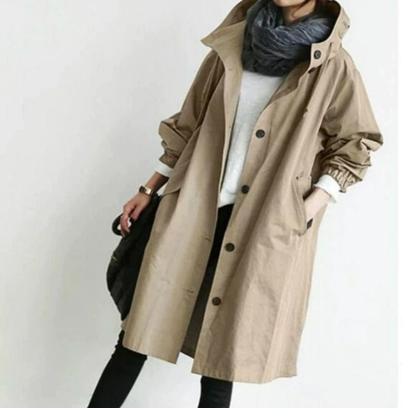 Trench-coat femme en tissu imperméable, protection pluie assurée. Style chic urbain et moderne pour la ville.