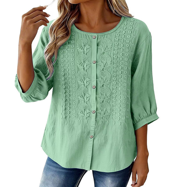 Blouse femme confortable, style bohème. Broderie fleurie et manches 3/4. Parfaite pour l'été.