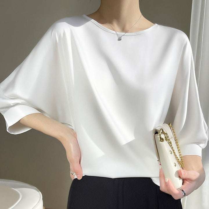Chemisier femme fluide et élégant à col rond, léger, idéal pour bureau ou style chic printemps-été.