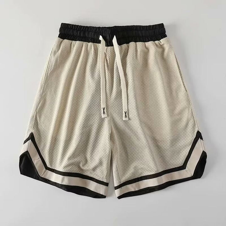 Short d'entraînement homme, tissu respirant, confort optimal pour le sport, la course et l'été.