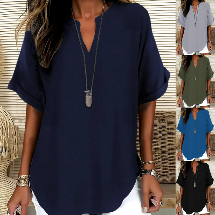 Blouse chic femme à coupe ample, col V. Parfaite pour le bureau ou un look décontracté estival.
